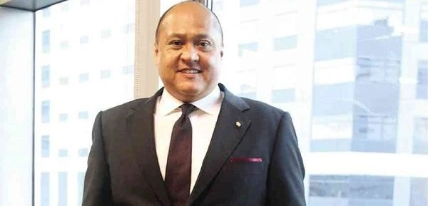 Portrait photo of Jose Arnulfo “Wick” Veloso in a suit