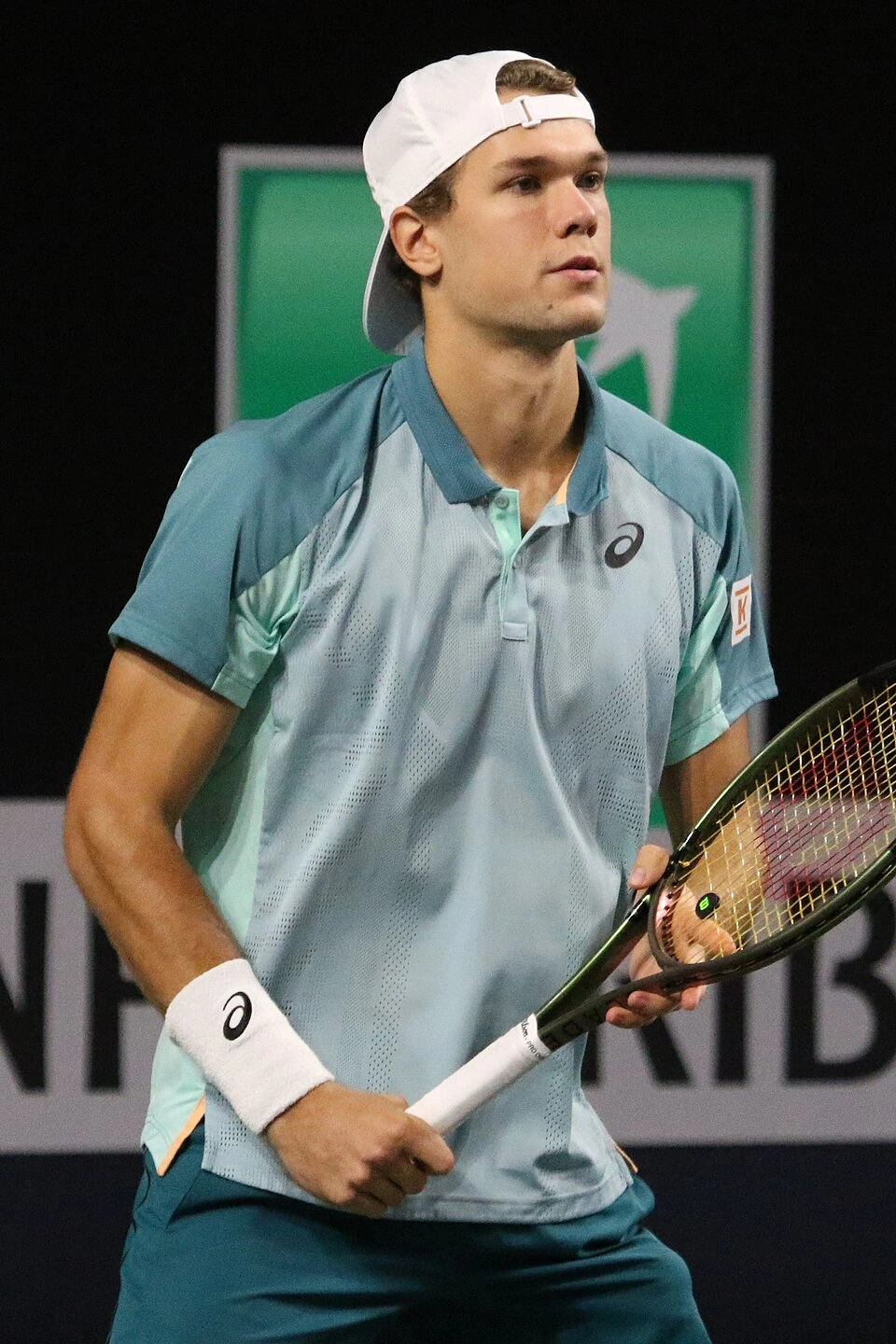 Otto Virtanen holding a tennis racket during a match