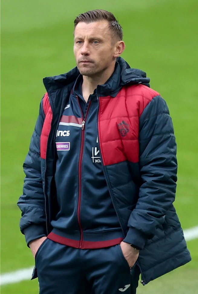 Ivica Olić standing on a football pitch in team training attire